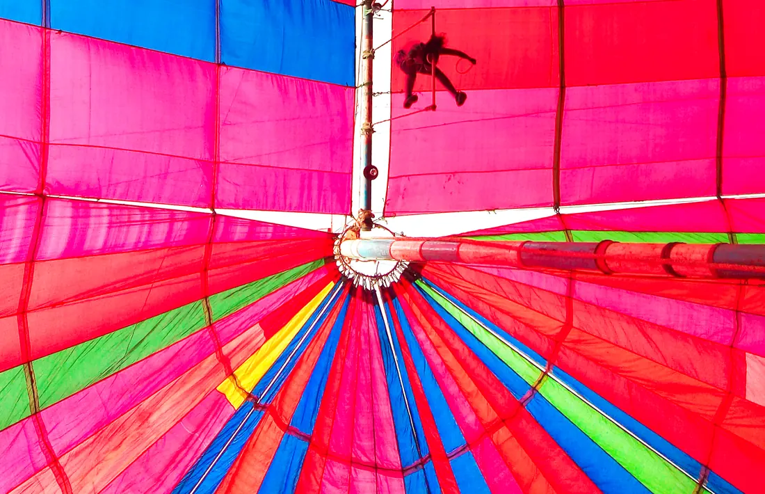 An aerial acrobat performing high above the stage