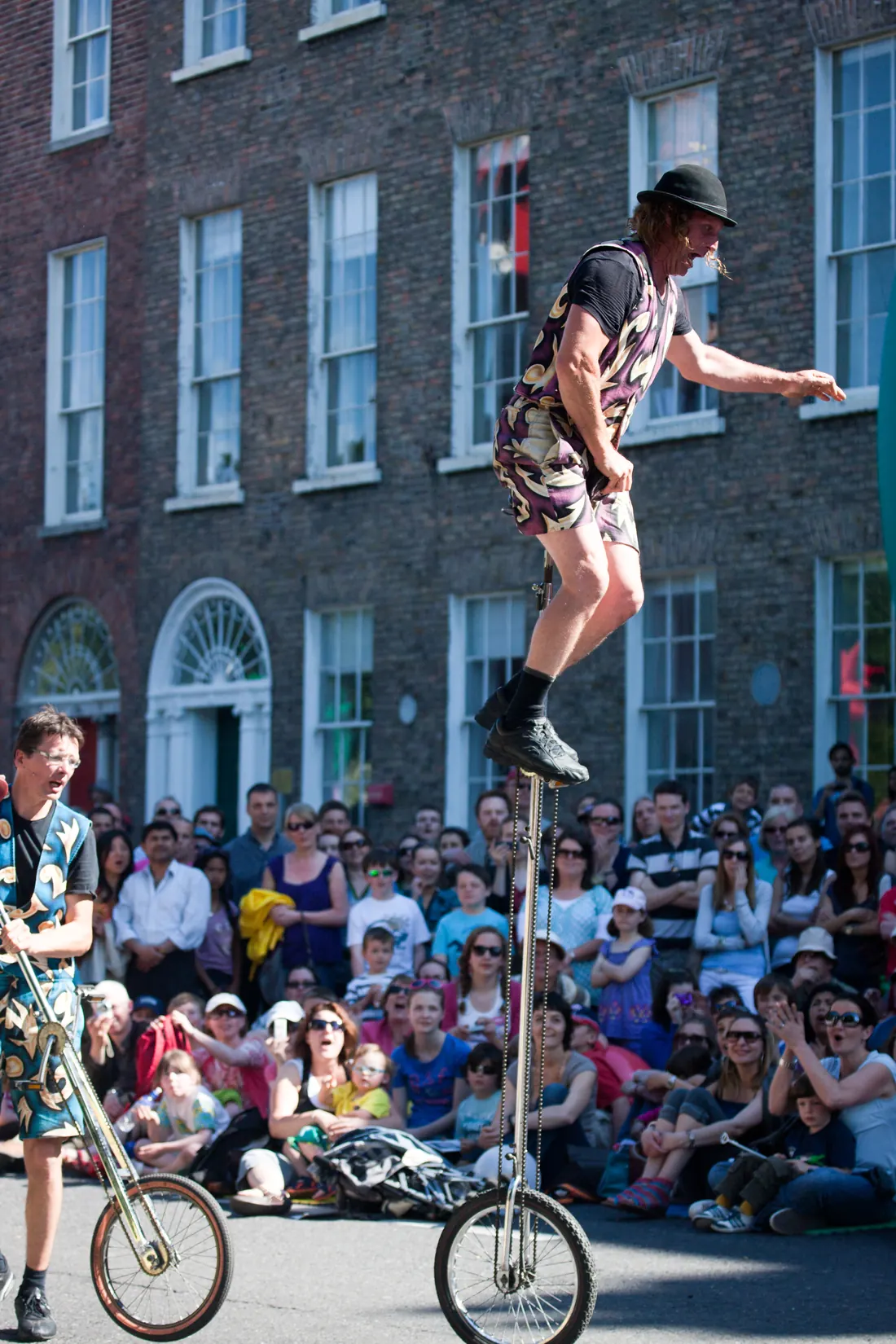 A contortionist performing an extreme backbend during a performance